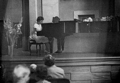 Rachel Galinne in a piano recital in honor of the Israel's Independence Day, the Jewish community of Stockholm, Sweden, the 60's (From Rachel Galinne's private Collection)