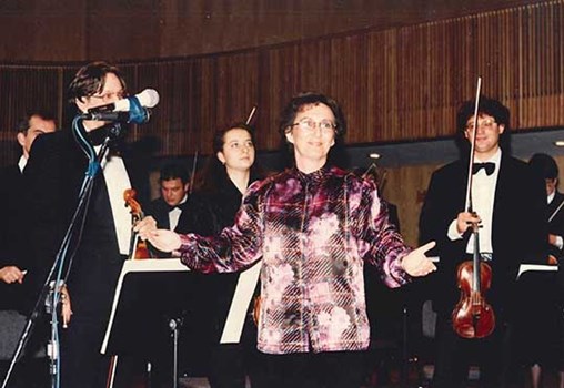 Rachel Galinne thanking the audience and the Tel-Aviv Symphony Orchestra at the end of a performance of her work "Depths of Light and Darkness" during the ceremony for the Prime Minister's Prize for Composers in 1994 (Call no. MUS 253 i-12)