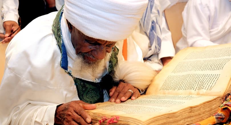 Liqa Kahenat Chief Kes Berko Tegegne reads from the Orit, written in the sacred language of Ge’ez. Photo: Michael Zekri