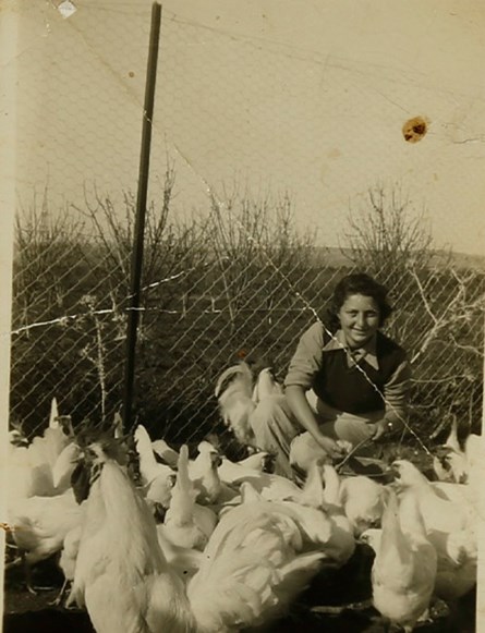 Hannah Senesh with chickens in Nahalal